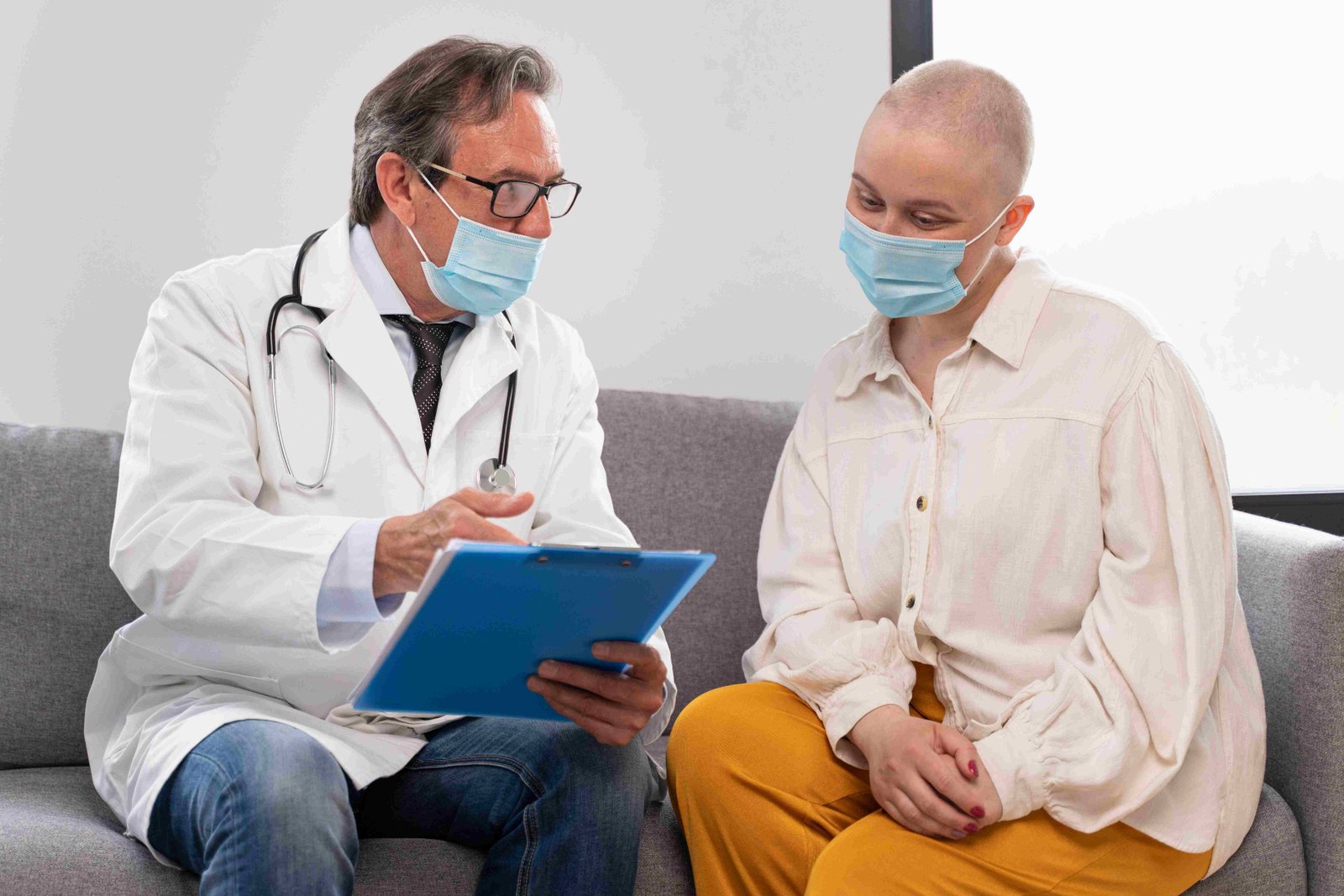 young woman suffering breast cancer talking with her doctor 11zon